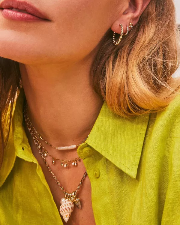 Oleana Gold Huggie Earrings In Spotted Shell^Kendra Scott Store